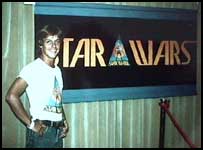 Mark Hammill In Front of Early Star Wars Banner (click to enlarge)